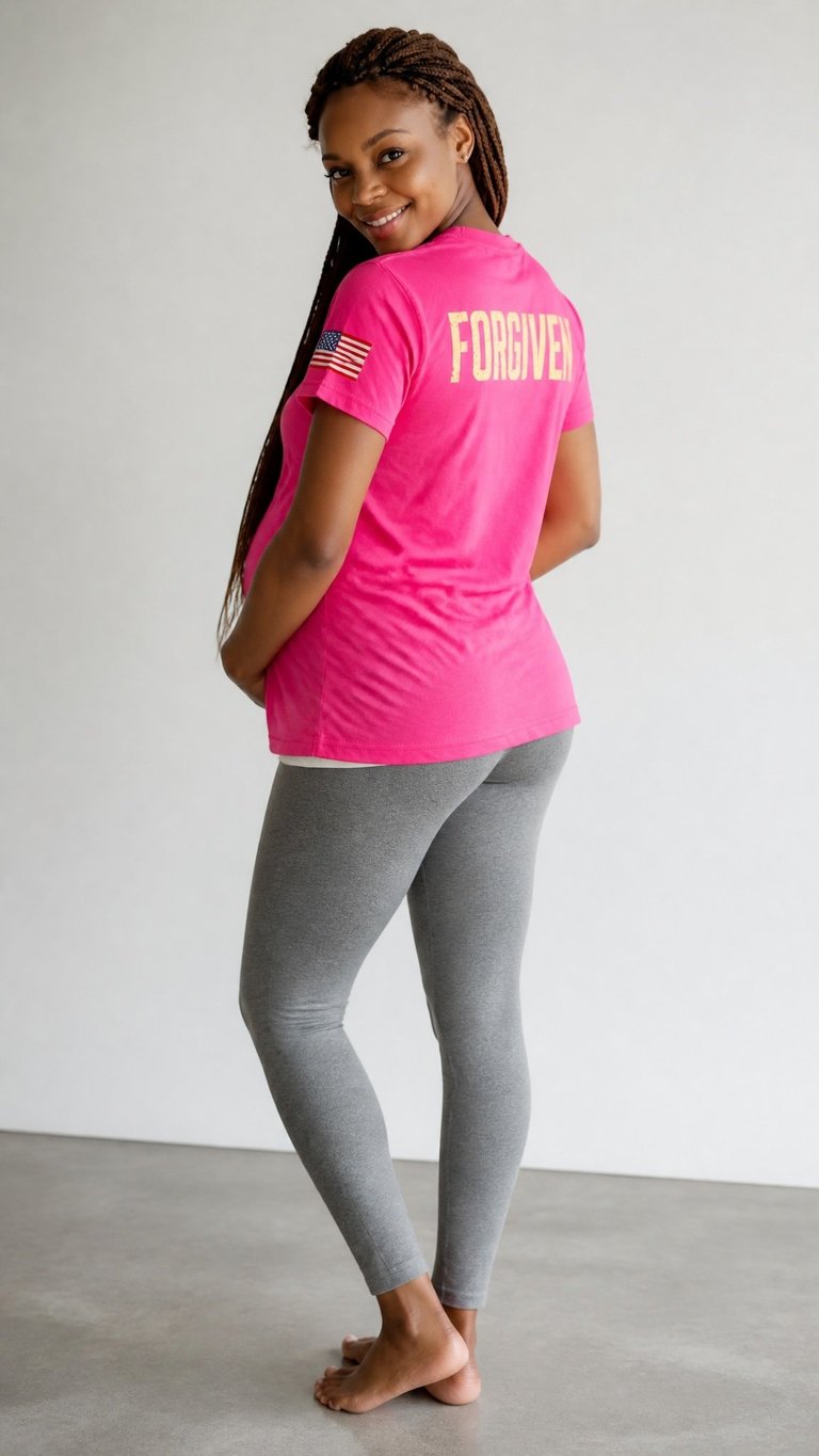 Woman wearing hot pink t-shirt with Forgiven text and gray leggings