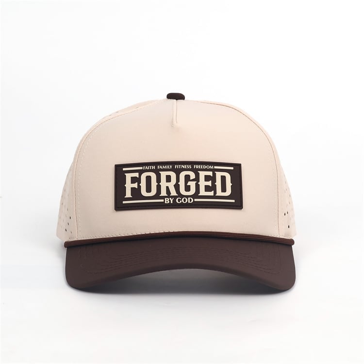Cream and brown two-tone trucker cap with black Forged by God patch and mesh back panels